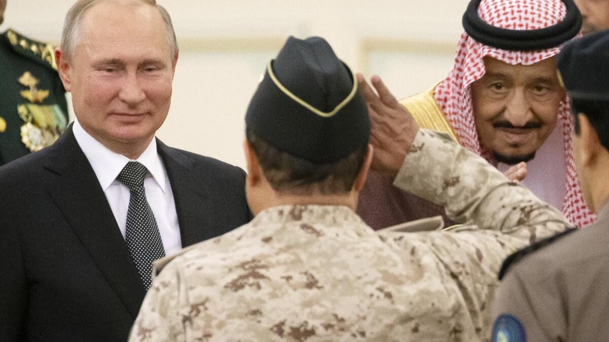 Russian President Vladimir Putin (L) and Saudi Arabia's King Salman (R) attend the official welcome ceremony in Riyadh, Saudi Arabia, on October 14, 2019. Alexander Zemlianichenko / POOL / AFP