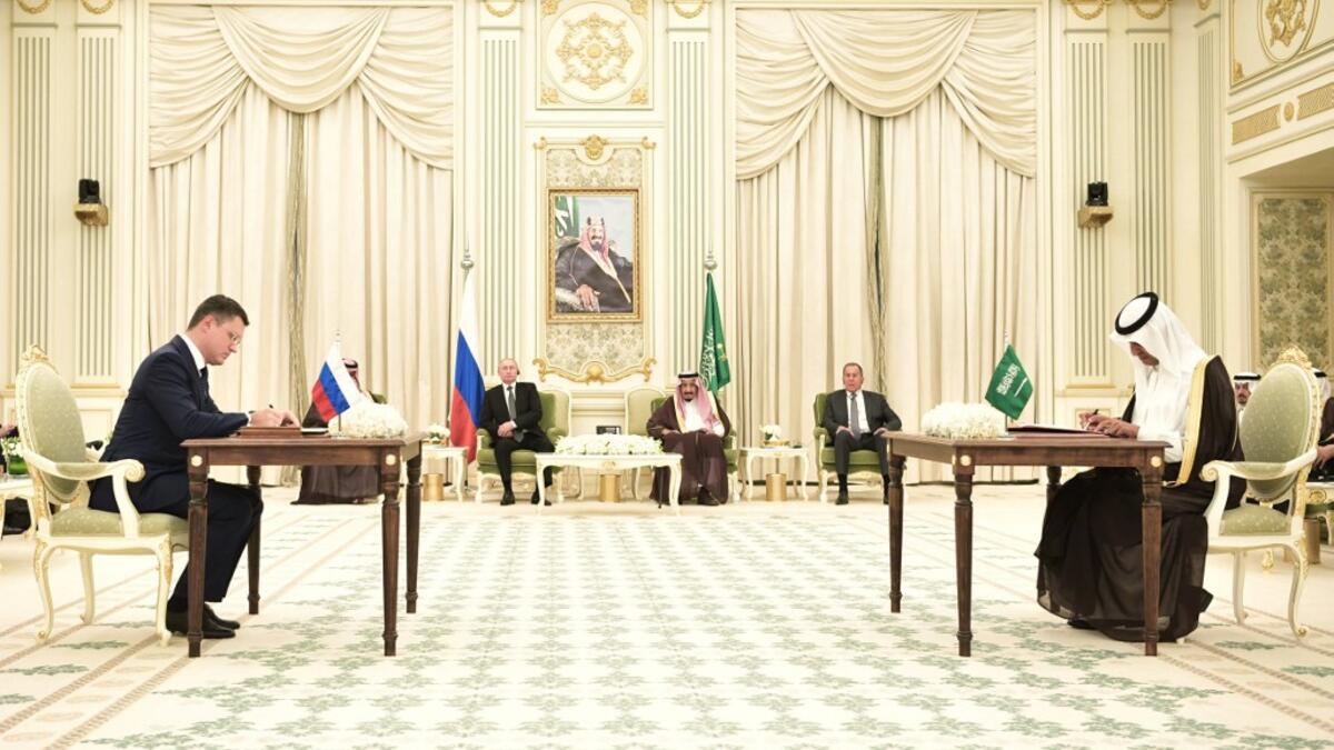 Russian Energy Minister Alexander Novak and Saudi Energy Minister Abdulaziz Bin Salman sign documents during a ceremony following a meeting of Russian President Vladimir Putin with Saudi Arabia's King Salman in Riyadh, Saudi Arabia, on October 14, 2019. Alexey NIKOLSKY / SPUTNIK / AFP