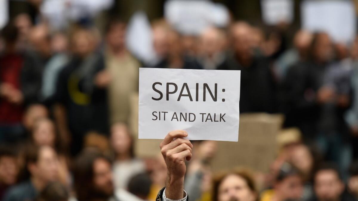 Nearly 600 people have been injured in clashes with police since the protests started. Demonstrators have set fire to cars and garbage bins and thrown rocks at police, who have responded with batons and rubber bullets. JOSE JORDAN / AFP
