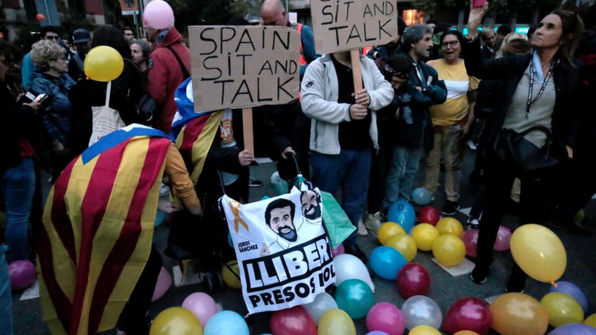 Protesters gather to participate in a "Balloons Party" demonstration called by the local Republic Defence Committees (CDR) outside the Catalan government's Interior Department on October 21, 2019 in Barcelona. Pau Barrena / AFP
