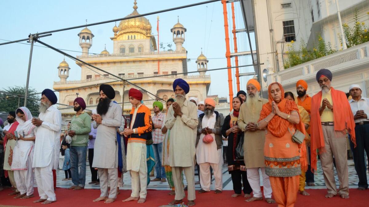 Sikh devotees visit the Golden Temple to mark Bandi Chhor Divas which coincides with the day of Diwali in Amritsar on October 27, 2019. Sikhs celebrate Bandi Chhor Divas on the same day as the Hindu festival of Diwali, to mark the historic return of the sixth Guru Hargobind. NARINDER NANU / AFP