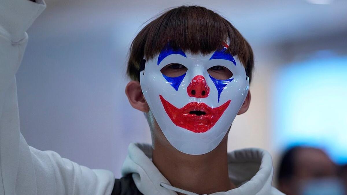 Pro-democracy demonstrators held up their phone lights and chanted slogans calling for a 'revolution of our times' (www.dailymail.co.uk)