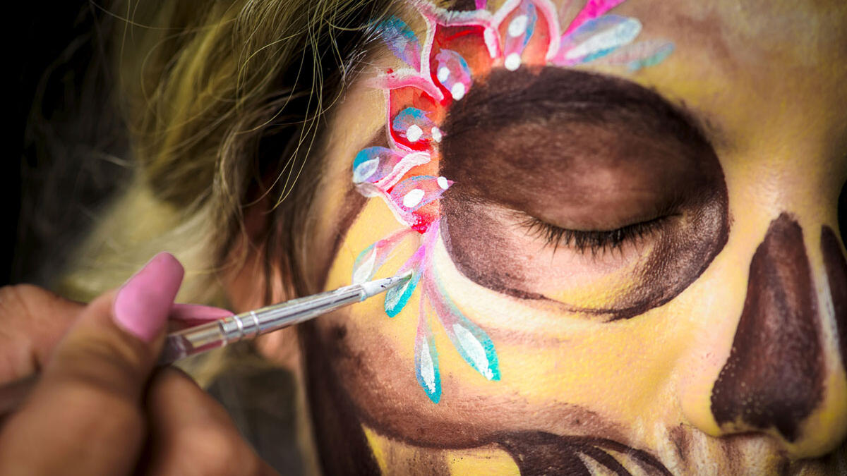 Ingrid Lopez is made up as Catrina by the artist Ixchel Garcia during a costume and makeup rehearsal for the Mega-Procession of the Catrinas in Mexico City. Omar Torres / AFP / Getty