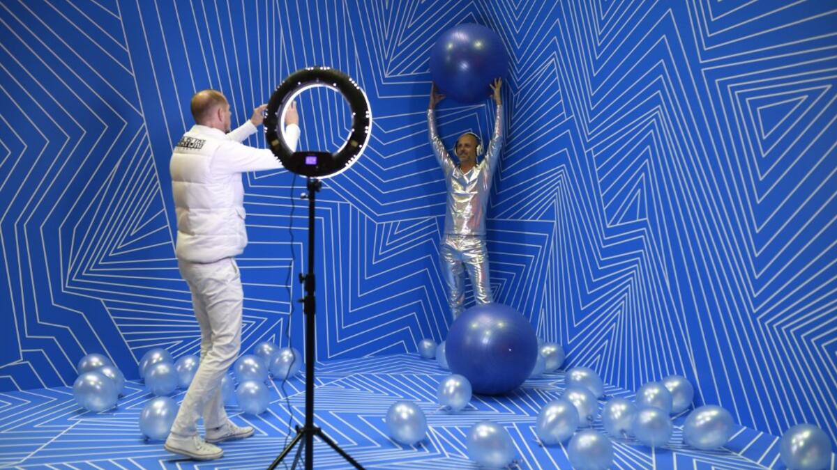 Manfred Dederl (R) is being photographed at the "Supercandy Pop-Up Museum Vol. 2" in Cologne, western Germany on November 1, 2019. It is an interactive museum and offers the perfect photo backdrop for social media at 25 stations. INA FASSBENDER / AFP