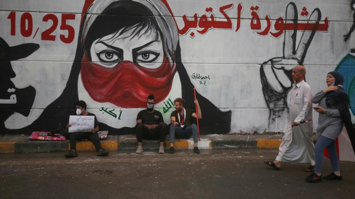 Iraqi protesters rest at Baghdad's Tahrir square during ongoing anti-government demonstrations on November 2, 2019. Iraqi security forces clashed with anti-government protesters in the early hours of Saturday near the capital's Tahrir Square, leaving one demonstrator dead and dozens more wounded, medical sources said. AHMAD AL-RUBAYE / AFP