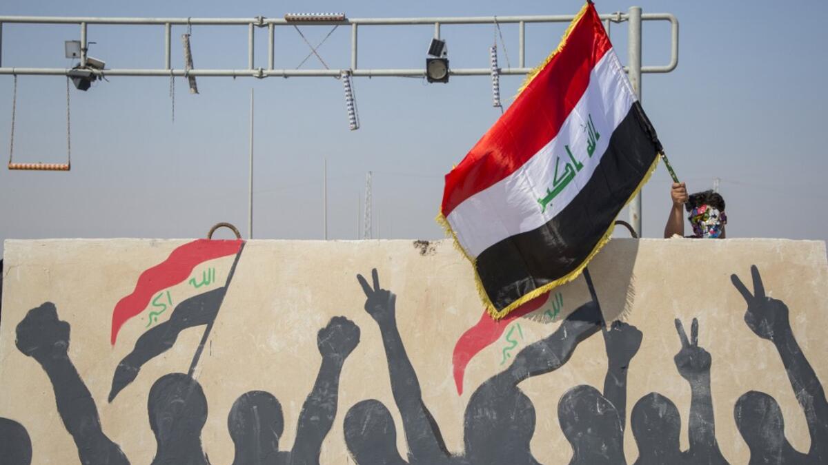 Iraqi protesters block the highway leading to Umm Qasr port during ongoing anti-government demonstrations in southern Iraq on November 3, 2019. Protesters in Iraq's capital and the country's south shut down streets and government offices in a new campaign of civil disobedience Sunday, escalating their month-long movement demanding change to the political system. Hussein FALEH / AFP