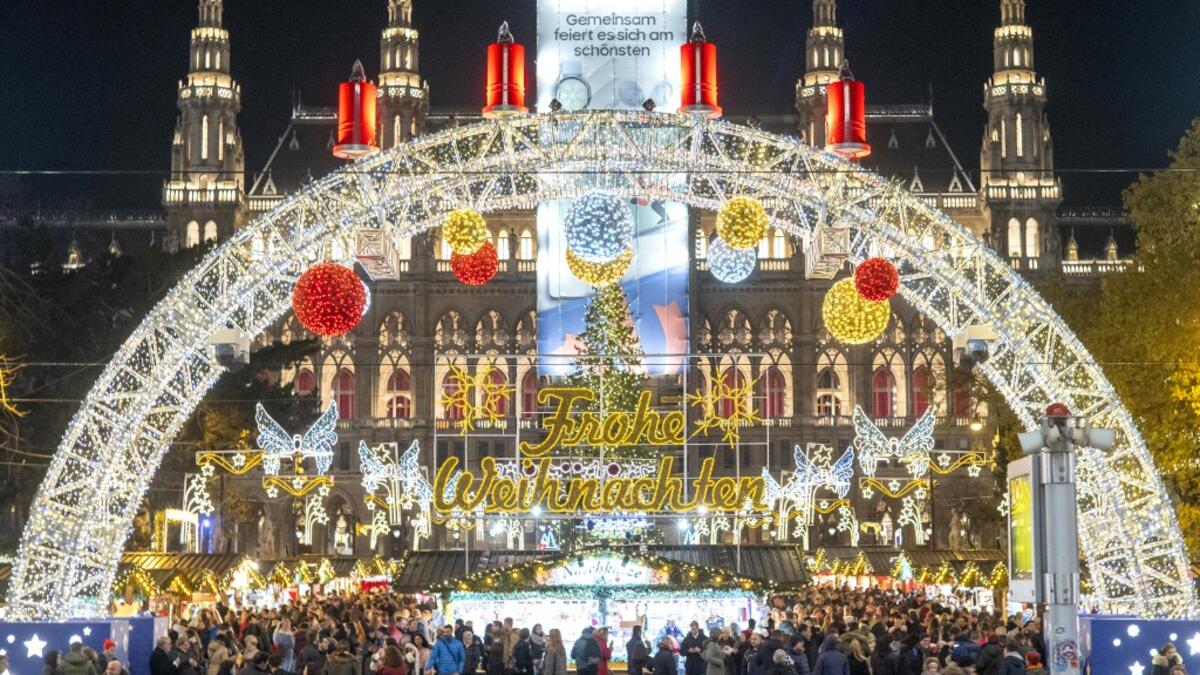 Visitors explore a Christmas market in front of Vienna's city hall in Vienna, Austria on November 19, 2019. JOE KLAMAR / AFP