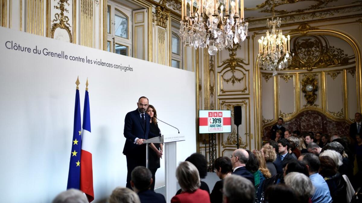 French Prime Minister Edouard Philippe (L) delivers a speech on domestic violence, next to French Junior Minister for Gender Equality Marlene Schiappa, on November 25, 2019 at the Hotel Matignon in Paris, during the International day for elimination of violence against women. STEPHANE DE SAKUTIN / POOL / AFP