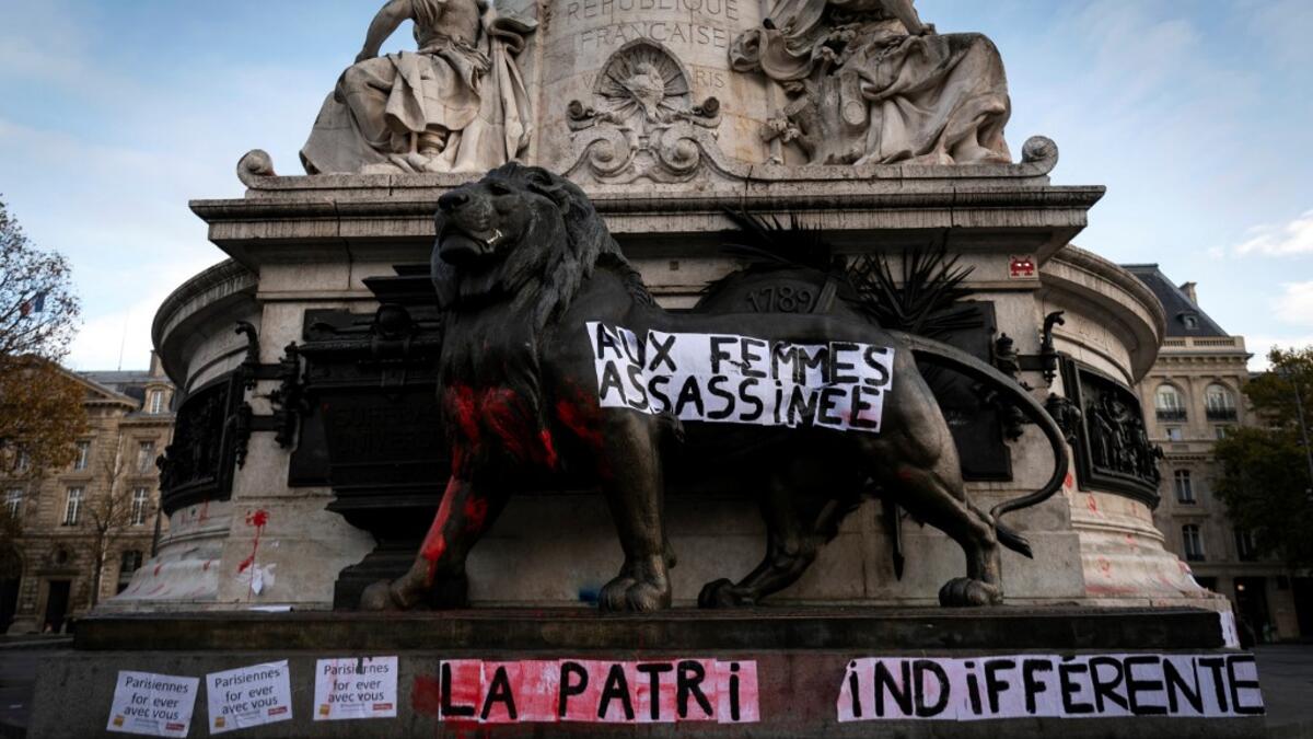 A banner dedicated to the memory of women killed by a current or former partner, and against violence towards women, hangs on the monument of the Republic square on November 25, 2019 in Paris, on the International Day for Eliminating Violence against Women.LIONEL BONAVENTURE / AFP