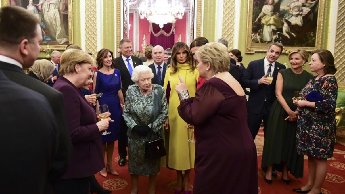 Britain's Queen Elizabeth II (C) talks with guests in Buckingham Palace in central London on December 3, 2019, during a reception hosted by Britain's Queen Elizabeth II ahead of the NATO alliance summit. NATO leaders gather Tuesday for a summit to mark the alliance's 70th anniversary but with leaders feuding and name-calling over money and strategy, the mood is far from festive. Geoff Pugh / POOL / AFP