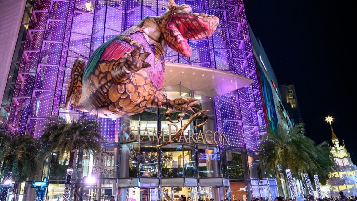 A giant balloon representing a mythical creature flies over the crowd during 'The Quest of Adventure in the World of Magical Tales' Christmas show performed by French group Plasticiens Volants in Bangkok on December 8, 2019. Mladen ANTONOV / AFP