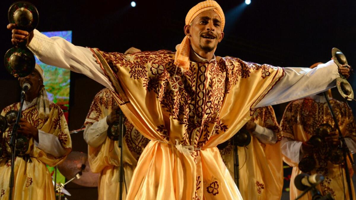 In this file photo taken on June 14, 2014 a member of Gnaoua (Gnawa) group Maalem Mohamed Kouyou performs in Essaouira at the Gnaoua World Music Festival. Gnawa culture, a centuries-old Moroccan practice rooted in music, African rituals and Sufi traditions, was on December 12, 2019 added to UNESCO's list of Intangible Cultural Heritage of Humanity. Fadel SENNA / AFP