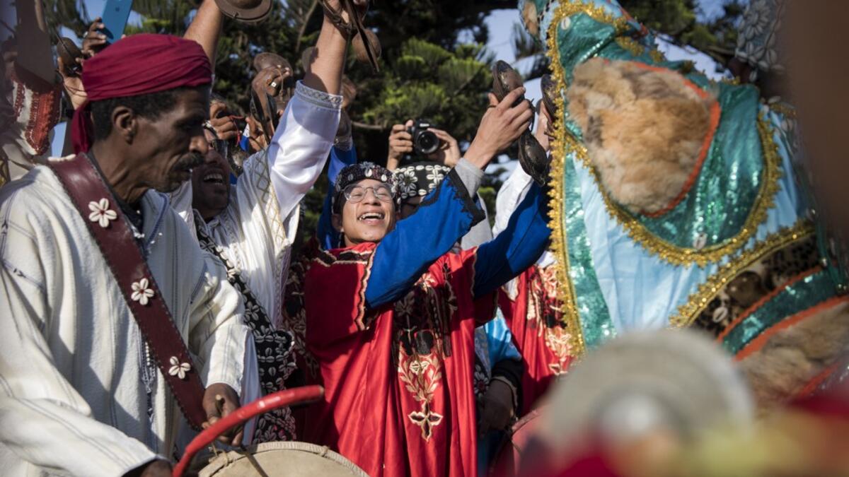 Often dressed in colourful outfits, Gnawa musicians play the guenbri, a type of lute with three strings, accompanied by steel castanets called krakebs. FADEL SENNA / AFP
