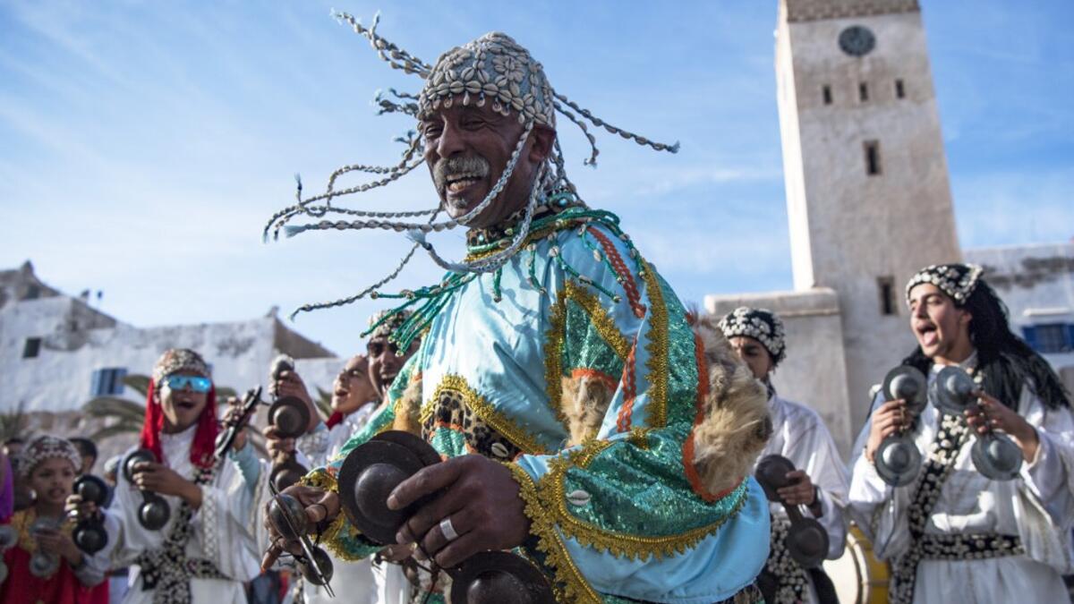A Gnawa traditional group performs in the city of Essaouira on December 14, 2019, to celebrate the decision of adding the Gnawa culture to UNESCO's list of Intangible Cultural Heritage of Humanity. FADEL SENNA / AFP
