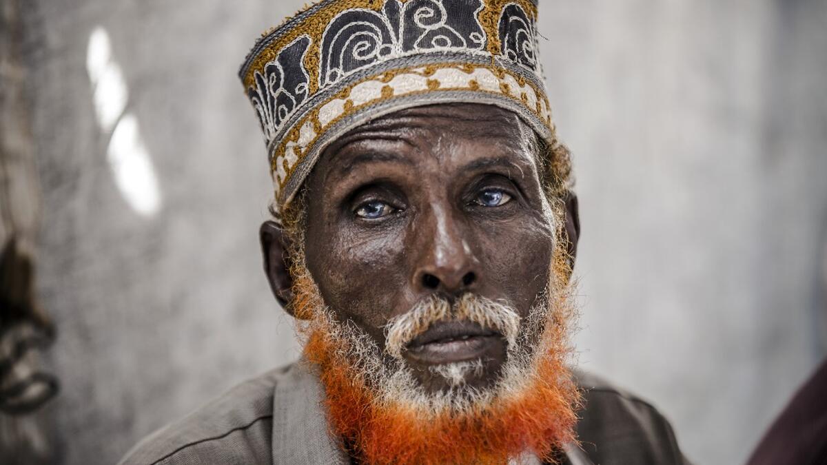 74-year-old Omar Dule, who lost his house due to the floods and heavy rains, gathers with some friends inside a United Nations tent at a displacement camp in Beledweyne, Somalia, on December 14, 2019. The rains have inundated big areas surrounding Beledweyne area forcing thousands of people to leave their houses and look for humanitarian assistance while living in displacement camps. Due to climate change and human activities, cycles of floods and droughts have become more recurrent and completely unpredict