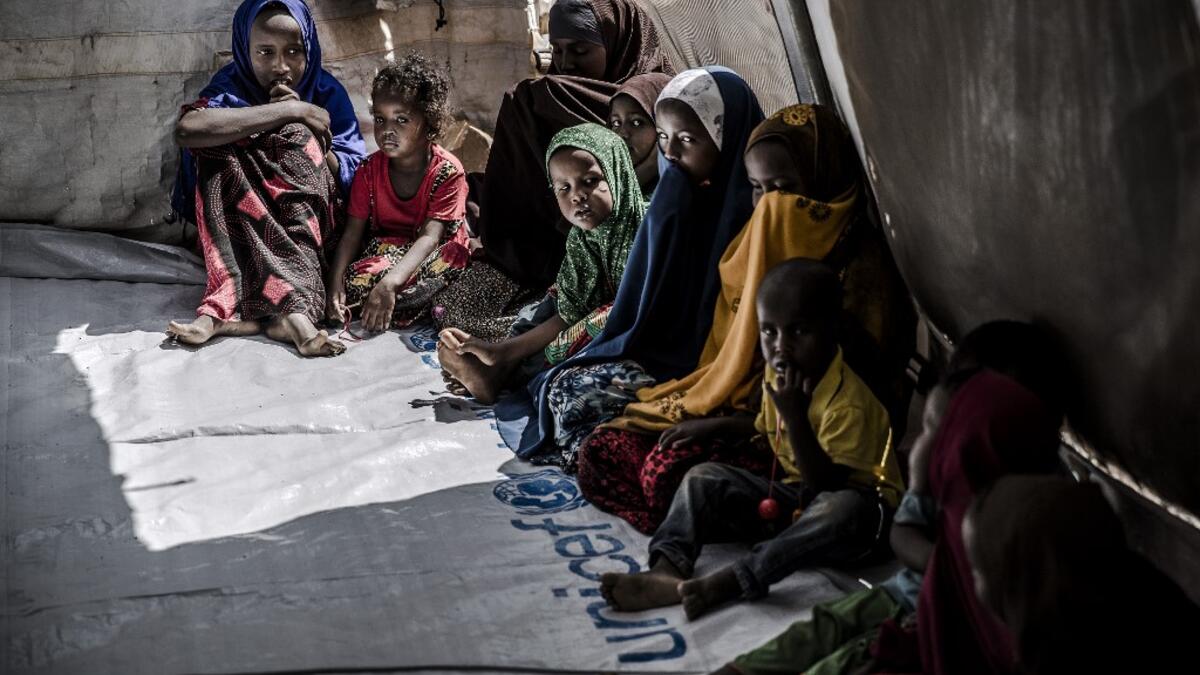 A group of displaced children, who were forced to leave their houses due to heavy rains and floods in the area, gather while attending activities for children in an United Nations tent at a displacement camp for families affected by floods located in Beledweyne, Somalia, on December 14, 2019. The rains have inundated big areas surrounding Beledweyne area forcing thousands of people to leave their houses and look for humanitarian assistance while living in displacement camps. Due to climate change and human