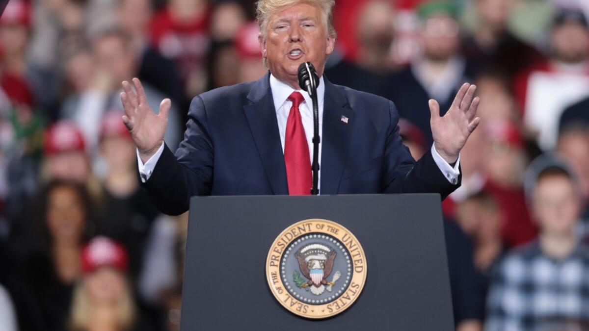 While Trump spoke at the rally the House of Representatives voted, mostly along party lines, to impeach the president for abuse of power and obstruction of Congress, making him just the third president in U.S. history to be impeached. Scott Olson/Getty Images/AFP