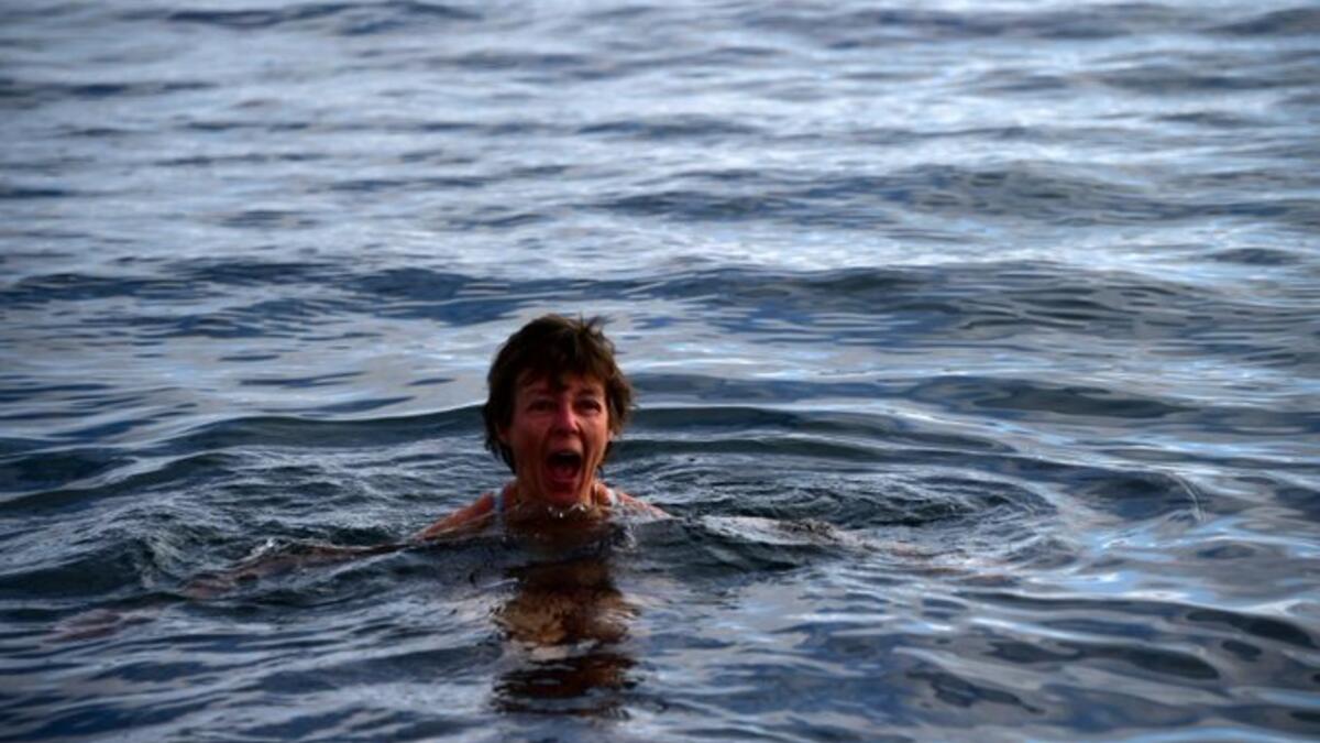 Tourists spend thousands to swim among the Penguins in Antarctica "It's like getting stabbed," a tourist exclaimed, as he plunged into the three-degree celsius water (Twitter)