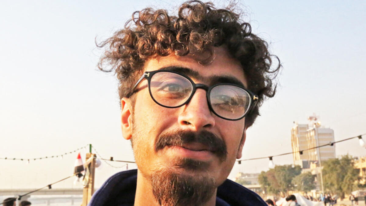 An Iraqi anti-government protestor poses with a distinct hairstyle at Tahrir Square in central Baghdad on December 23, 2019. Since the start of Iraq's anti-government protests on October 1, one thing strikes the eye perhaps above all else -- the unbridled hairstyles young men sport. High quiffs, tight fades and loads of attitude -- it is quite the male beauty pageant. SABAH ARAR / AFP