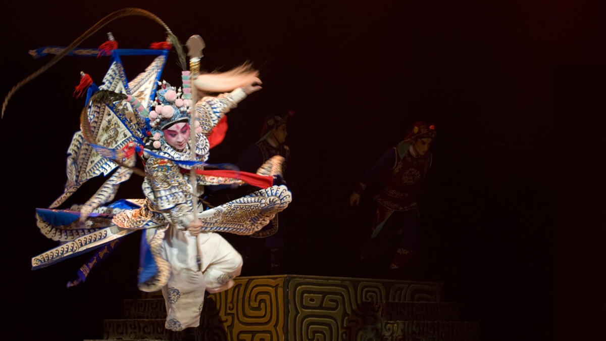 Chinese opera actor performs traditional drama onstage (Shutterstock)