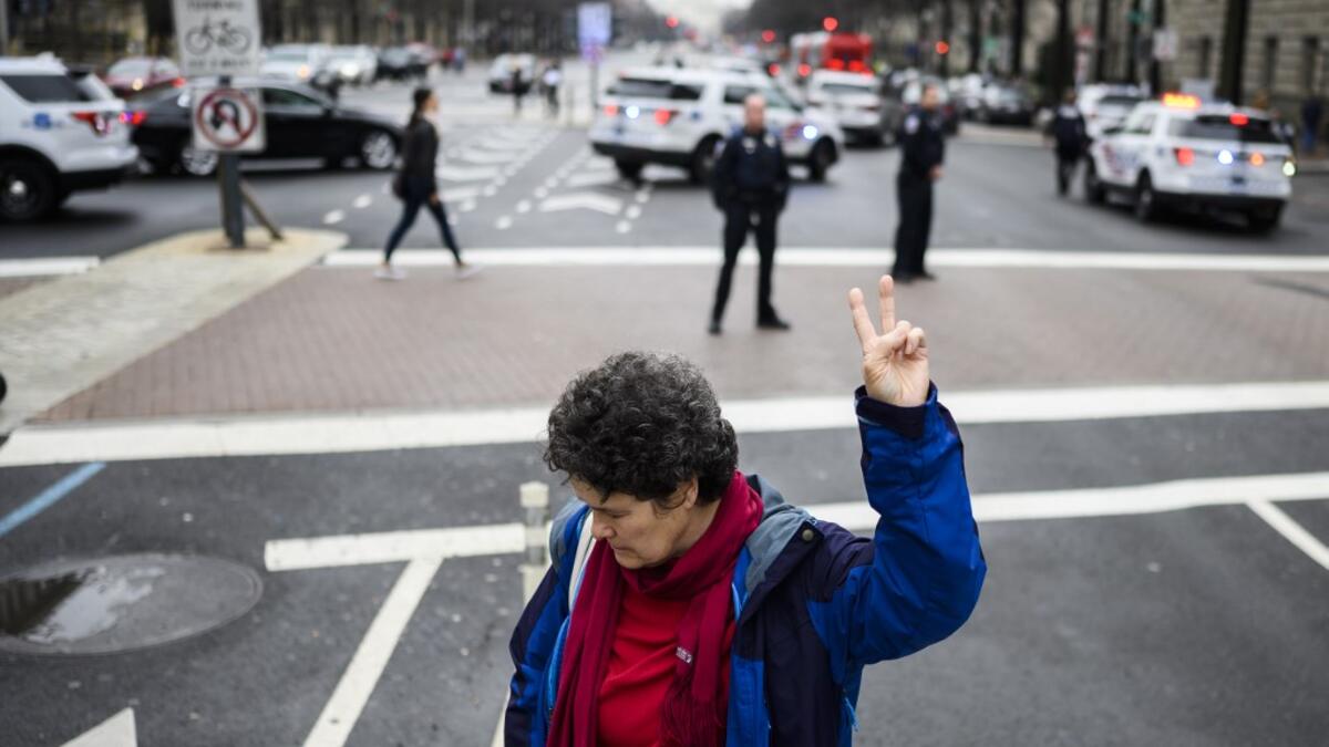 Mary Kepferle,an anti-war activist demonstrates outside the Trump International Hotel in Washington, DC, on January 4, 2020. Demonstrators are protesting the US drone attack which killed Iran's Major General Qasem Soleimani in Iraq on January 3, a dramatic escalation in spiralling tensions between Iran and the US, which pledged to send thousands more troops to the region. ANDREW CABALLERO-REYNOLDS / AFP