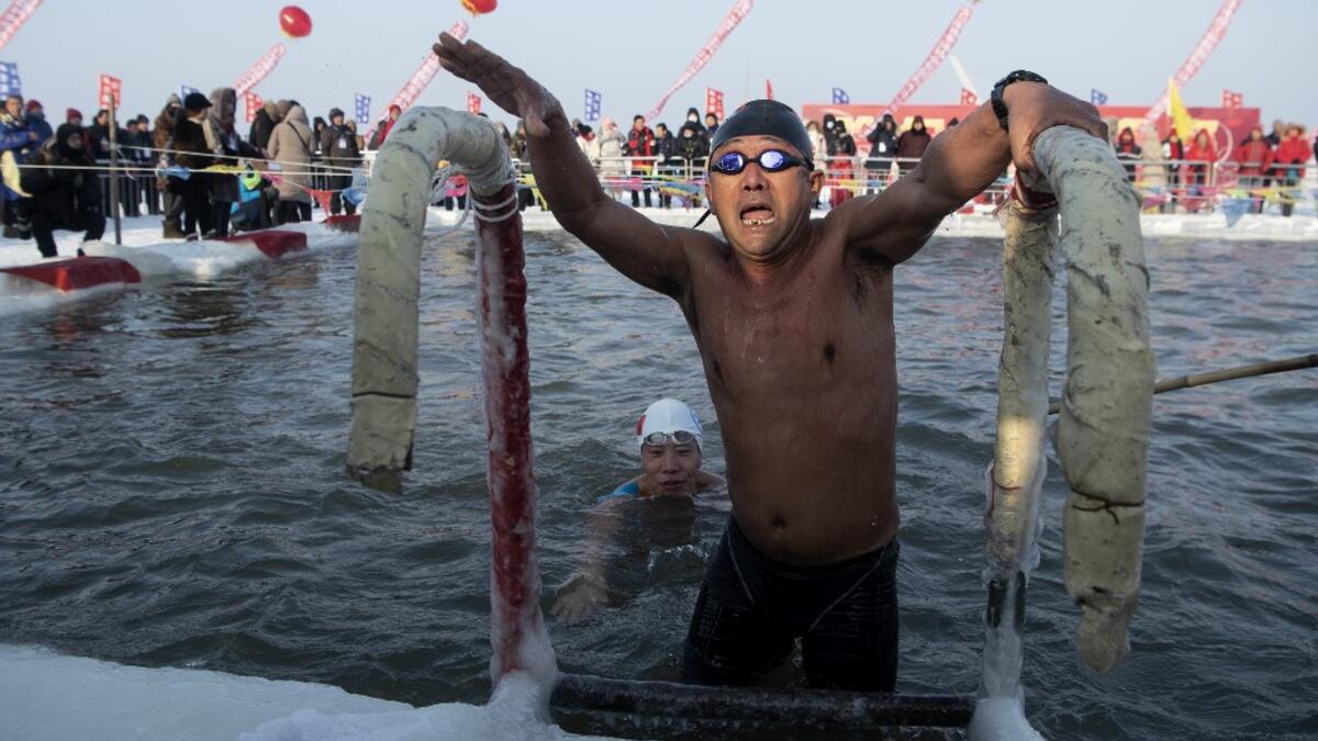 A swimmer participates in the winter swimming competition ahead of the opening of the Harbin International Ice and Snow Festival in Harbin, China's northeast Heilongjiang province on January 5, 2020. Noel CELIS / AFP