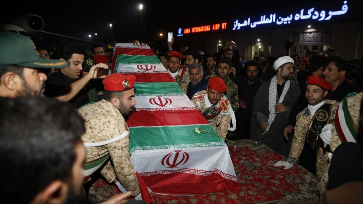 Military personnel carry the casket of Iranian commander Qasem Soleimani upon arrival at Ahvaz International Airport in Tehran on January 5, 2020. A tide of mourners packed the streets of the Iranian city of Ahvaz Sunday to pay respects to top general Qasem Soleimani, days after he was killed in a US strike. HOSSEIN MERSADI / fars news / AFP