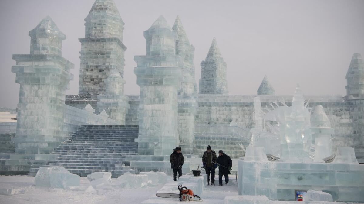 China's annual ice festival in Harbin has kicked off late on January 5 with couples lining up for a snow-themed mass wedding, swimmers braving frigid waters and frozen palaces rising from the ground. NOEL CELIS / AFP