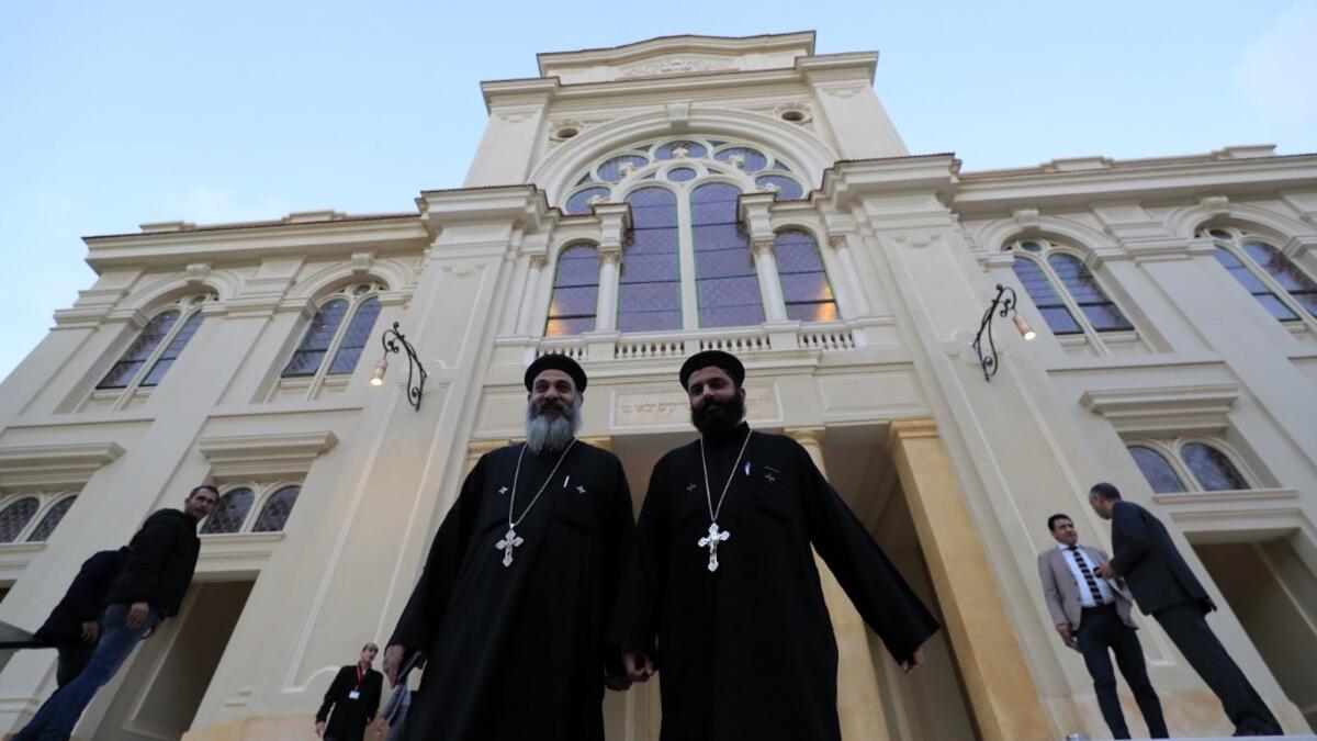 Coptic priests leave after visiting the newly renovated Eliyahu Hanavi synagogue in the northwestern Egyptian city of Alexandria on January 10, 2020, on the day of its inauguration. The synagogue, boasting green and violet stained glass windows and towering marble columns, was built in its current form in 1850 by an Italian architect on top of the original edifice dating back to 1354. Khaled DESOUKI / AFP