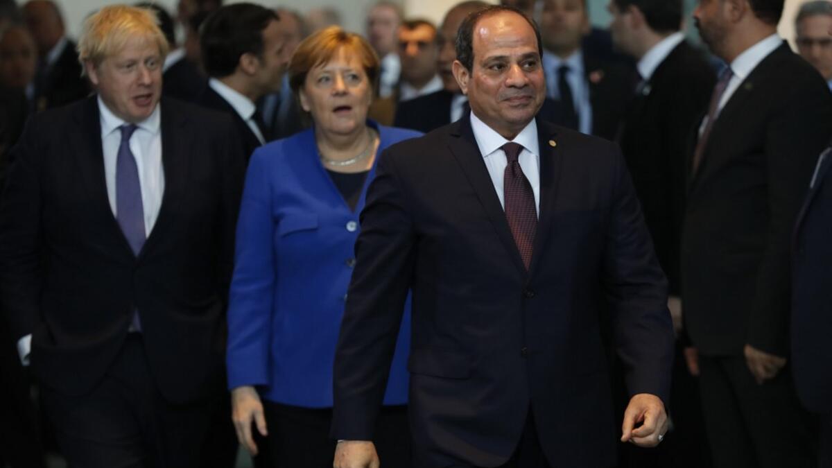 Egyptian President Abdul Fattah al-Sisi arrives for a family picture during a Peace summit on Libya at the Chancellery in Berlin, on January 19, 2020; back, from left: Britain's Prime Minister Boris Johnson and German Chancellor Angela Merkel. World leaders gather in Berlin. AFP