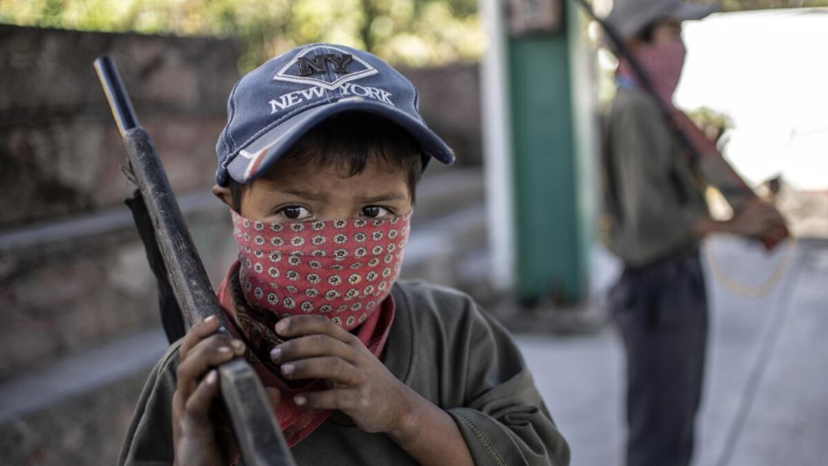 The CRAC-PF vigilante group trains children as young as five so they can protect themselves from drug-related criminal groups operating in the area. Pedro PARDO / AFP