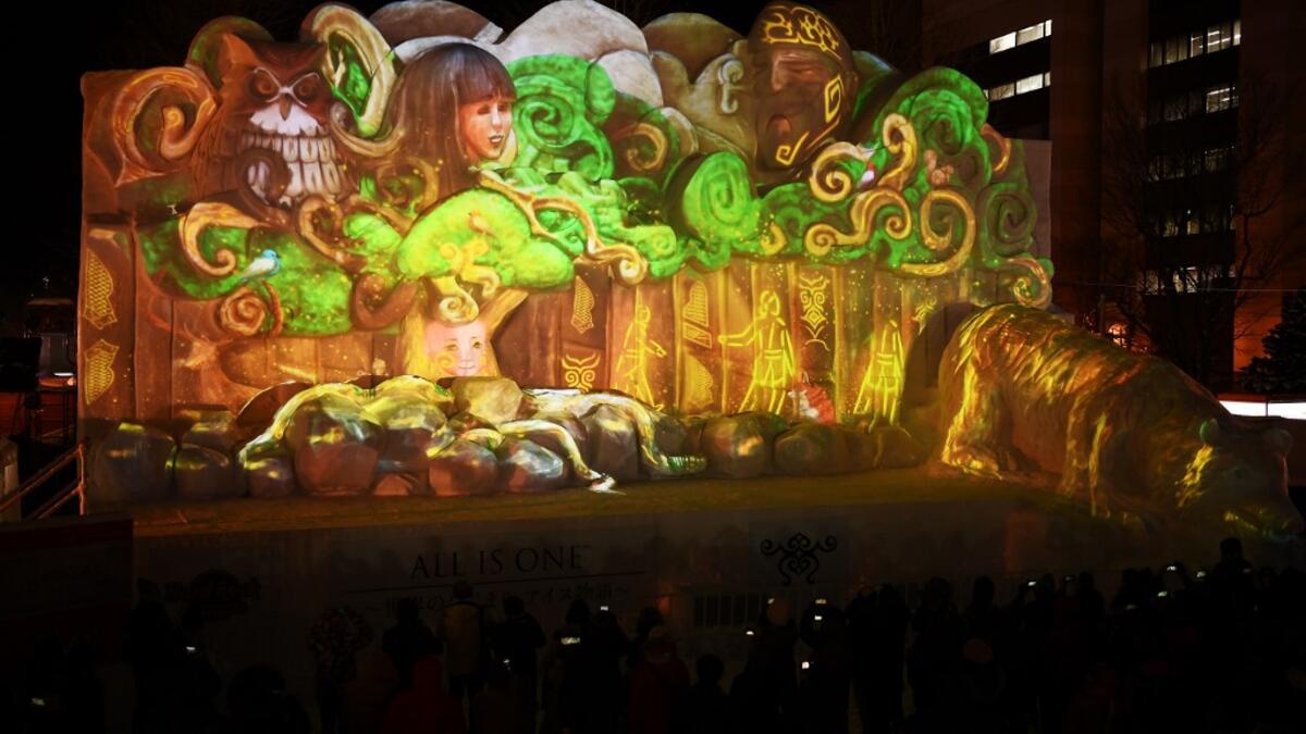 Organisers for this year's festival were forced to truck in an unprecedented amount of extra powder to build their signature sculptures after an unseasonably warm winter.  CHARLY TRIBALLEAU / AFP