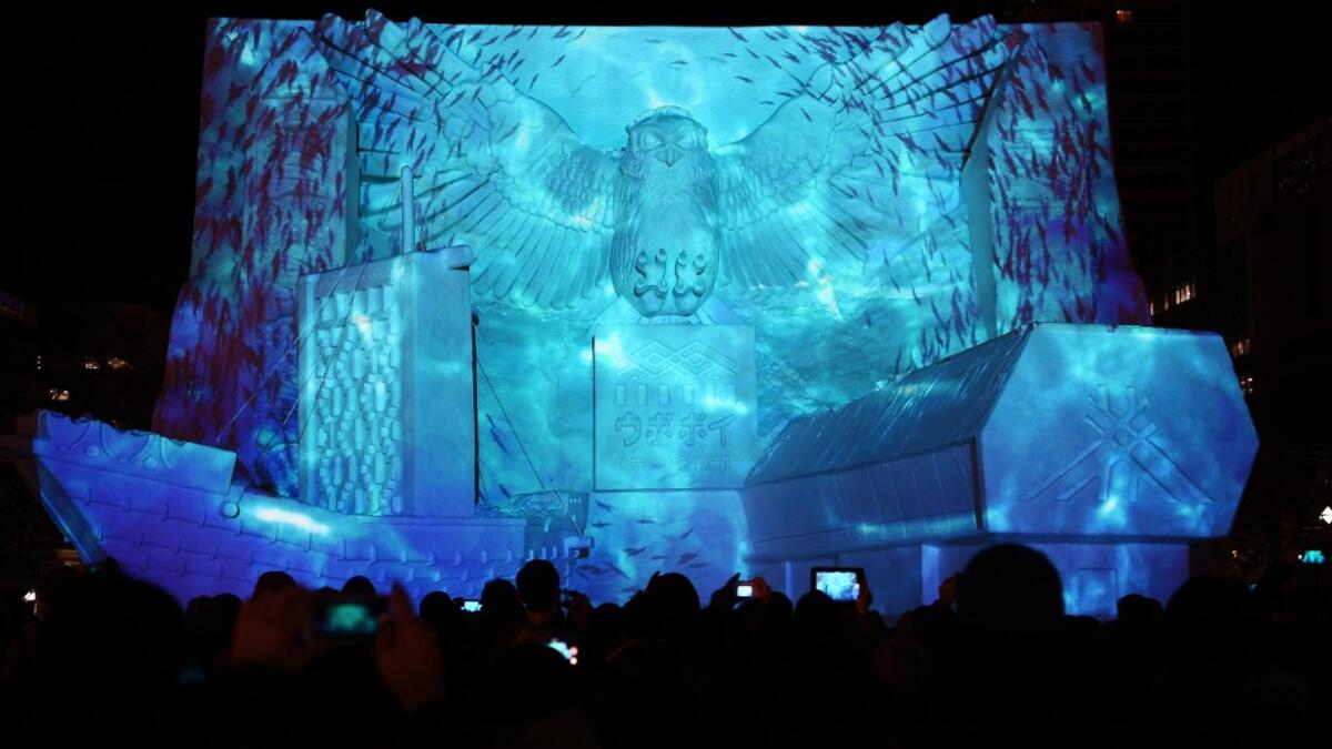 he snow festival, which opened January 31 in the capital of Hokkaido in northern Japan, is a major draw for the region, attracting more than 2.7 million visitors last year. Organisers for this year's festival were forced to truck in an unprecedented amount of extra powder to build their signature sculptures after an unseasonably warm winter.  CHARLY TRIBALLEAU / AFP