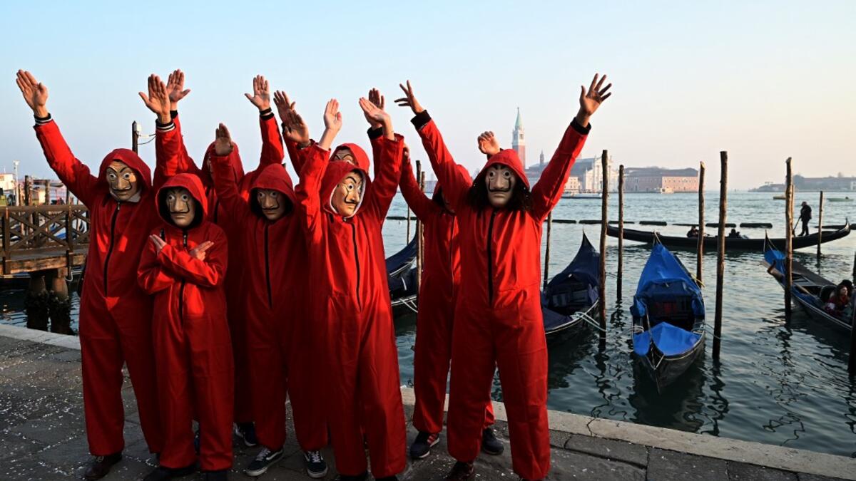 Masked revellers poses in Riva degli Schiavoni during the opening of the Venice Carnival on February 09, 2020. The carnival in Venice takes place until February 25, 2020. Vincenzo PINTO / AFP