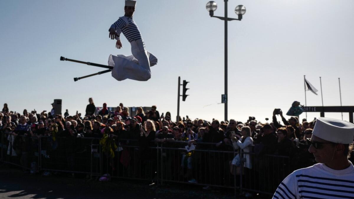 Participants in fancy dress take part in the 136th Nice Carnival parade which celebrates this year the 'Fashion King' in Nice, southeastern France, on February 15, 2020. The carnival runs from February 15 to February 29, 2020. VALERY HACHE / AFP