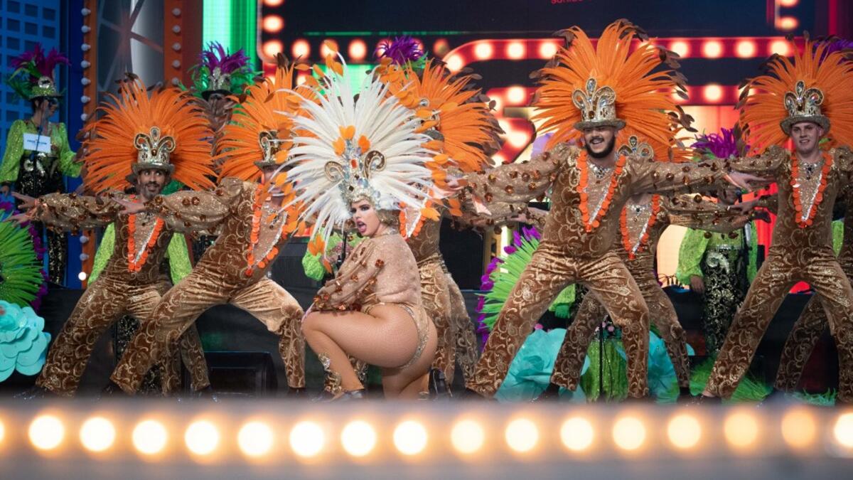Dancers perform on the main stage in the Battle of the Troops contest during carnival celebrations in Santa Cruz de Tenerife, on the Spanish Canary island of Tenerife, on February 15, 2020. The event begins on January 24 and finishes on March 1 with orchestras playing Caribbean and Brazilian rhythms throughout the festivities that range from the election for the Carnival Queen, the Junior Queen and the Senior Queen, children and adult murgas (satirical street bands), comparsas (dance groups) to performances
