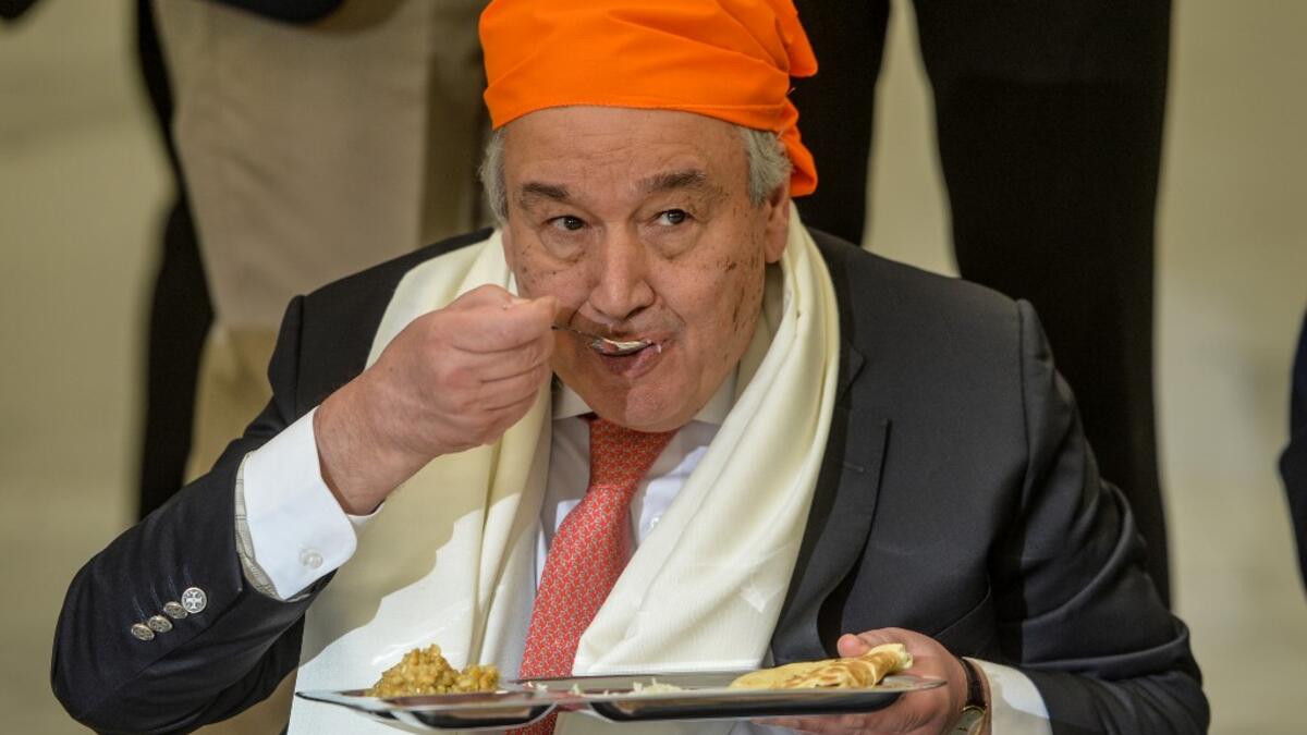 United Nations Secretary-General Antonio Guterres eats food at the Langar Khana during his visit of the Sikh Shrine of Baba Guru Nanak Dev at Gurdwara Darbar Sahib in Kartarpur near the Pakistan-India border, on February 18, 2020. Aamir QURESHI / AFP