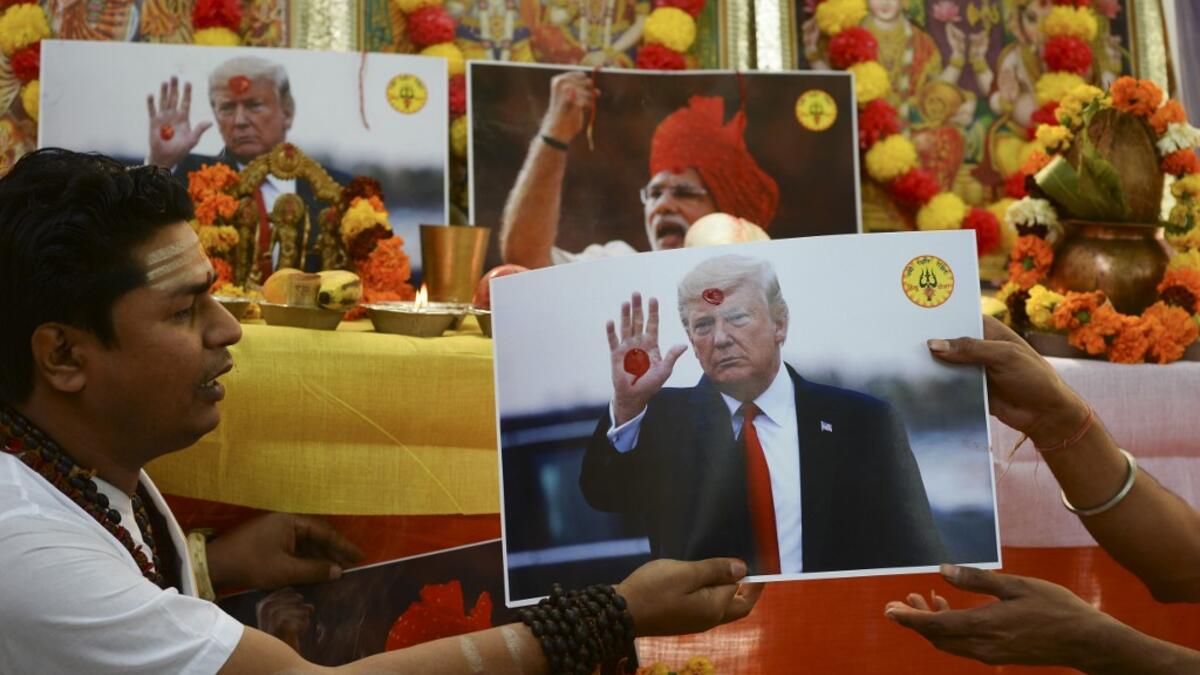 Hindu priests perform rituals during prayers organised by Hindu Sena, a far-right Hindu group, seeking blessings from gods and to unite India and the United States of America against radical Islamic fanatics, in New Delhi on February 24, 2020, on the occasion of US President Donald Trump first official visit to India. Sajjad HUSSAIN / AFP