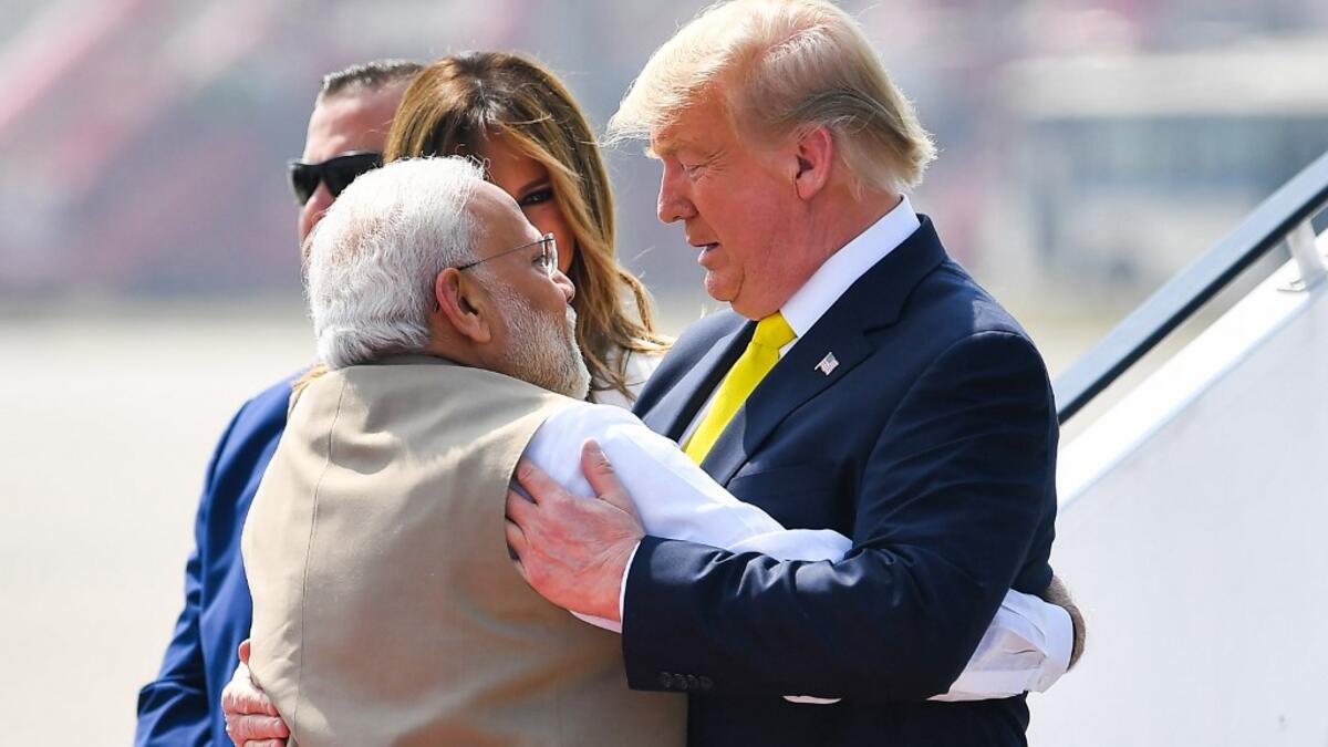 India's Prime Minister Narendra Modi (L) embraces US President Donald Trump upon his arrival at Sardar Vallabhbhai Patel International Airport in Ahmedabad on February 24, 2020. MANDEL NGAN / AFP