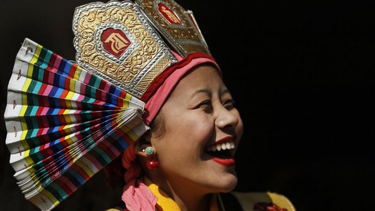Woman in traditional dress during Tibetan New Year in Kathmandu (Twitter)