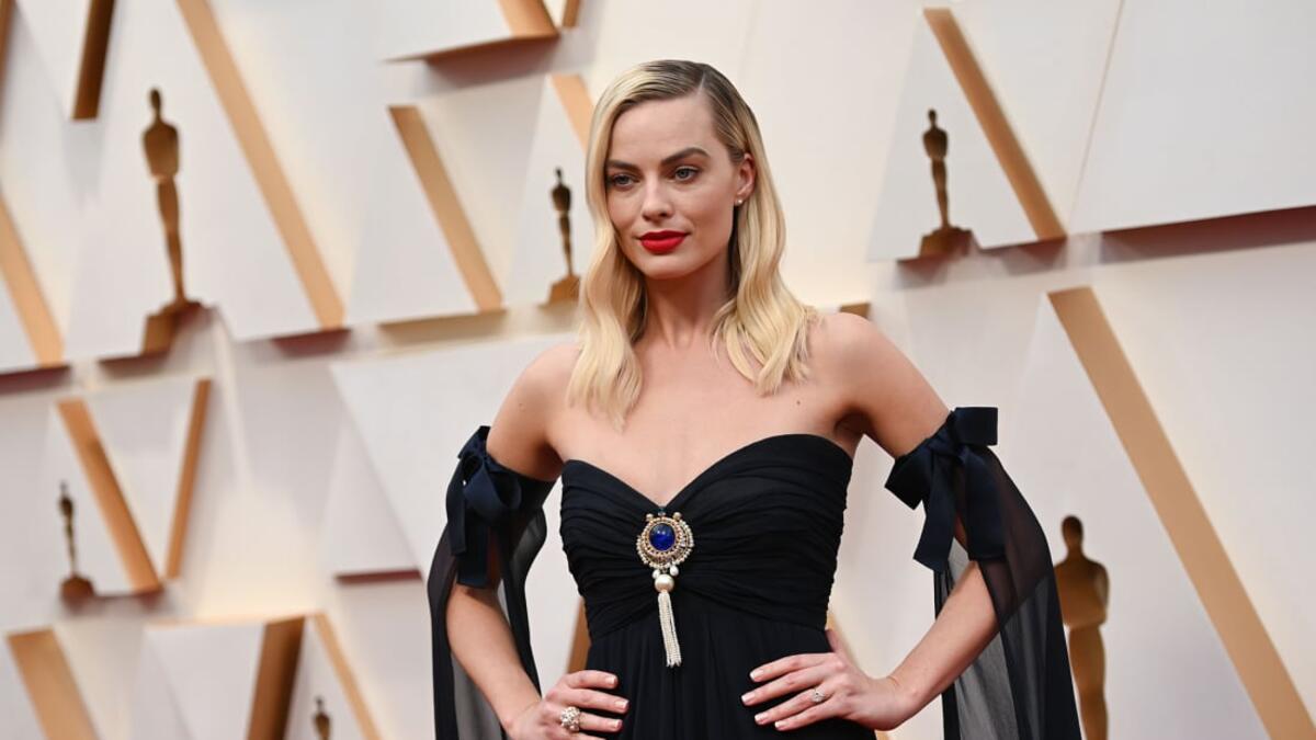 Margot Robbie stepped out in a vintage strapless navy Chanel dress