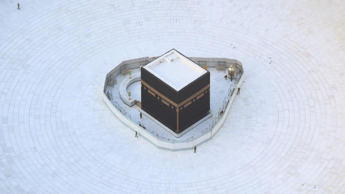 An aerial view shows an empty white-tiled area surrounding the Kaaba in Mecca's Grand Mosque, on March 6, 2020. An eerie emptiness enveloped the sacred Kaaba in Mecca's Grand Mosque, Islam's holiest site, where attendance at Friday prayers was hit by measures to protect against the deadly new coronavirus. Bandar ALDANDANI / AFP