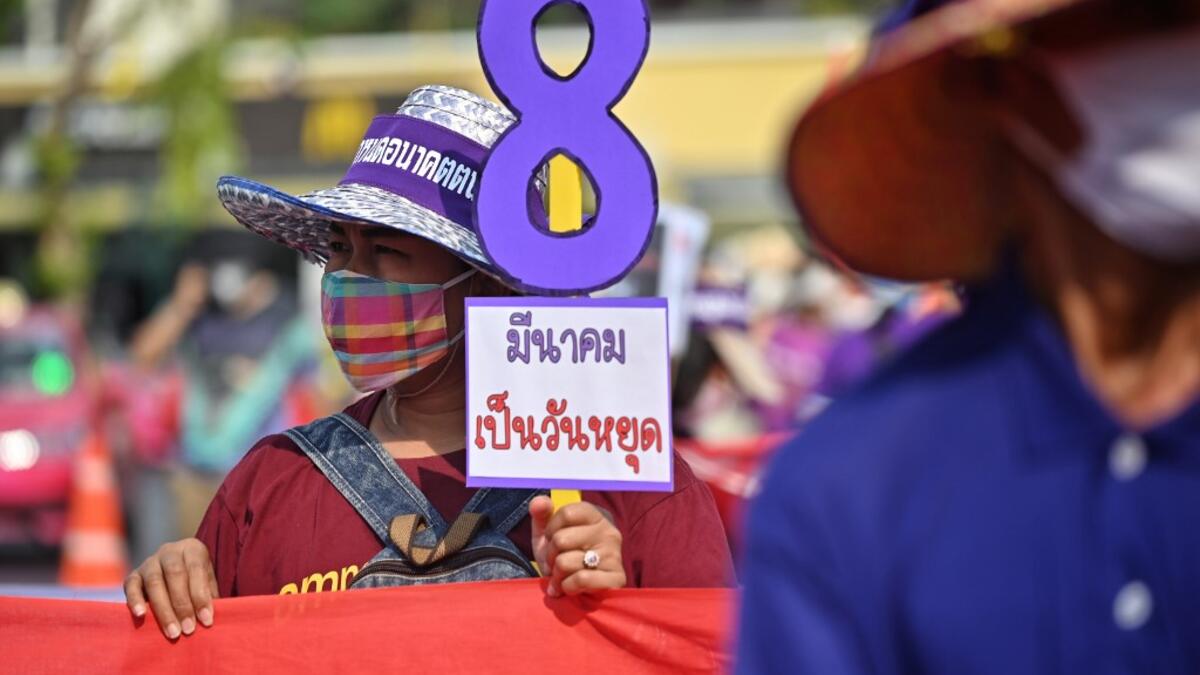 Members of Thai labour rights groups and state enterprise unions march for labour rights on International Women’s Day in Bangkok on March 8, 2020. Lillian SUWANRUMPHA / AFP