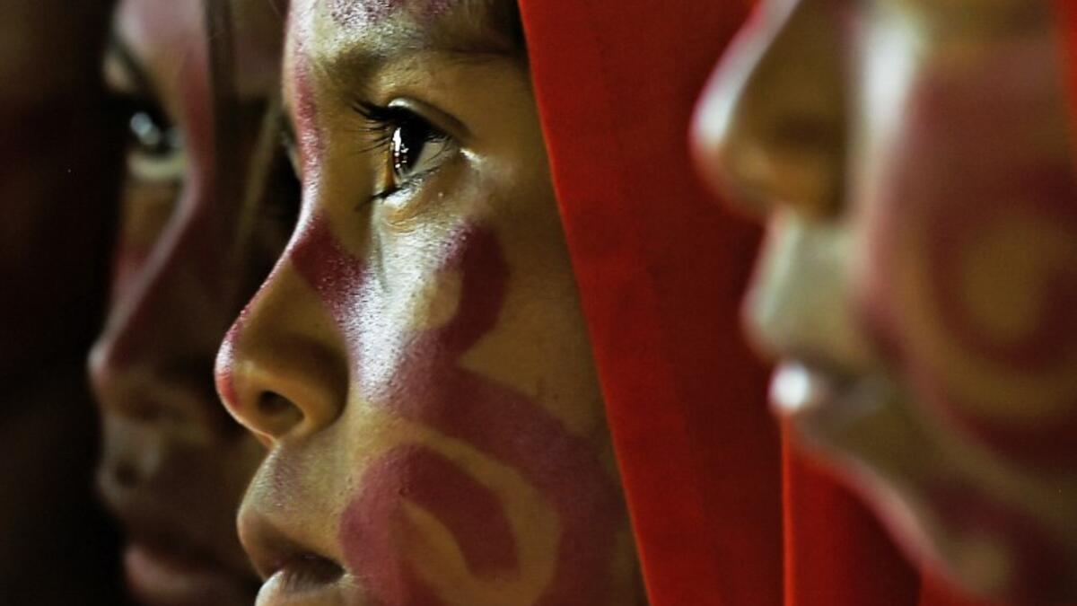 Wayuu girls prepare to perform the traditional La Yonna dance, in Tres Bocas, northern Colombia, on March 13, 2020. Juan BARRETO / AFP
