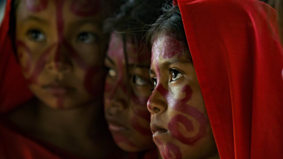 Wayuu girls prepare to perform the traditional La Yonna dance, in Tres Bocas, northern Colombia, on March 13, 2020. Juan BARRETO / AFP
