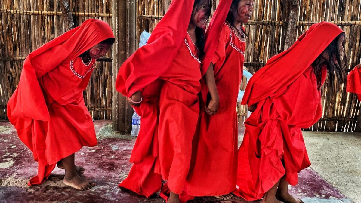 Wayuu girls prepare to perform the traditional La Yonna dance, in Tres Bocas, northern Colombia, on March 13, 2020. Juan BARRETO / AFP