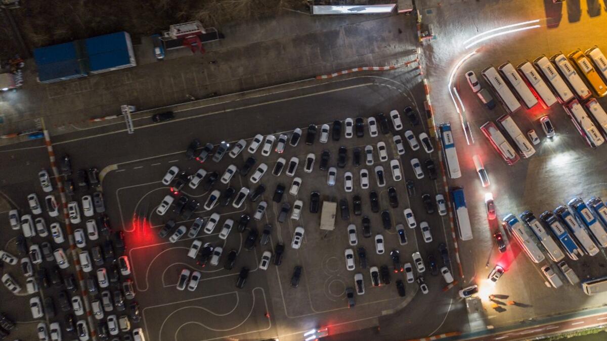 A photo taken on March 21, 2020 shows an aerial view of a drive-through cinema in Seoul. Box office numbers in South Korea -- which has 8,897 confirmed virus cases -- have plummeted in recent weeks due to the epidemic, with authorities urging the public to avoid large crowds. Ed JONES / AFP