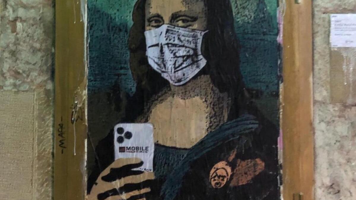 Italian artist TV Boy took to the image of Mona Lisa in his piece Mobile World Virus in Barcelona. (Facebook/ @tvboyofficial)