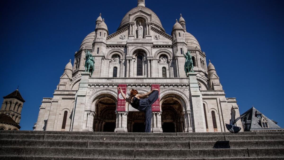 Syrian dancer and choreographer Yara al-Hasbani performs a dance on the empty Trocadero square in front of the Eiffel tower in Paris on April 22, 2020, on the 37th day of a strict lockdown in France to stop the spread of COVID-19 (novel coronavirus). Yara al-Hasbani was putting the finishing touches to her make-up for a performance of "Romeo and Juliet" in Damascus when she found out her father had been tortured to death. Sameer Al-DOUMY / AFP