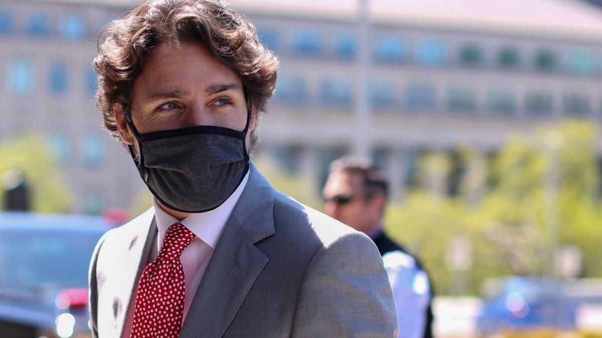 In this file photo Canadian Prime Minister Justin Trudeau arrives on Parliament Hill to attend a sitting of the Special Committee on the COVID-19 Pandemic, May 20, 2020 in Ottawa, Canada. Beijing's linking of its detention of two Canadians in China to the arrest of a Chinese executive in Vancouver shows it doesn't understand the meaning of an independent judiciary, Prime Minister Justin Trudeau said May 21, 2020. China detained former Canadian diplomat Michael Kovrig and businessman Michael Spavor in Decemb